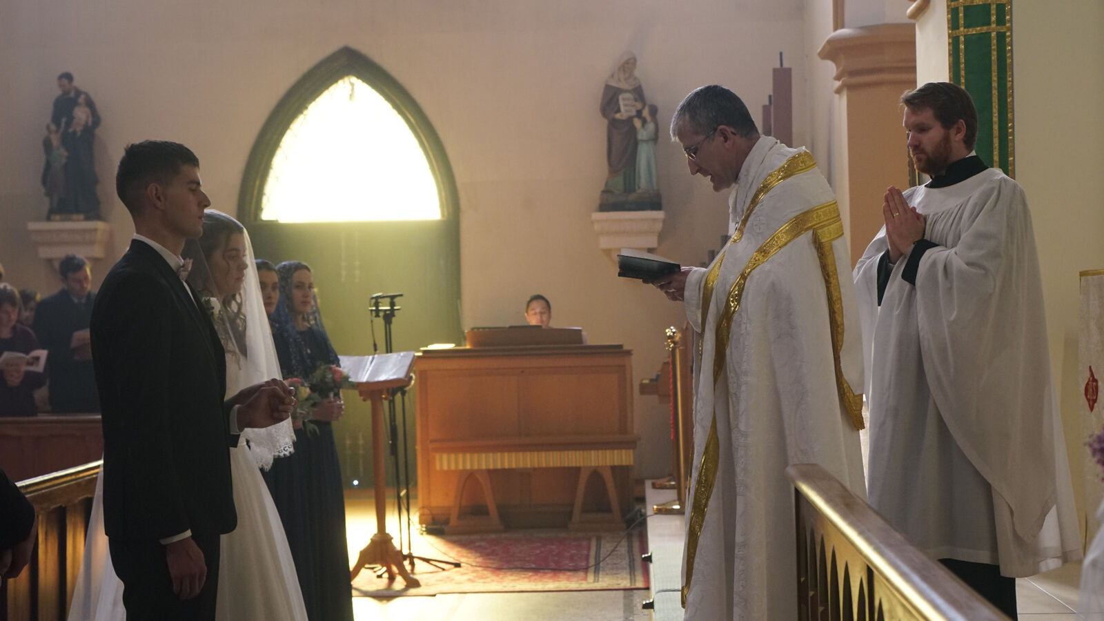 A young Christian couple at their wedding ceremony